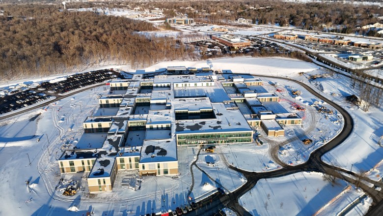 aerial view of a building complex on snow-covered ground
