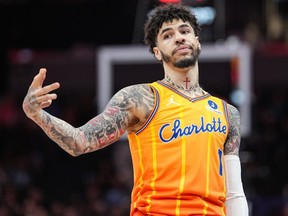 Charlotte Hornets guard LaMelo Ball gestures after making a three-point basket during a game against the Memphis Grizzlies.