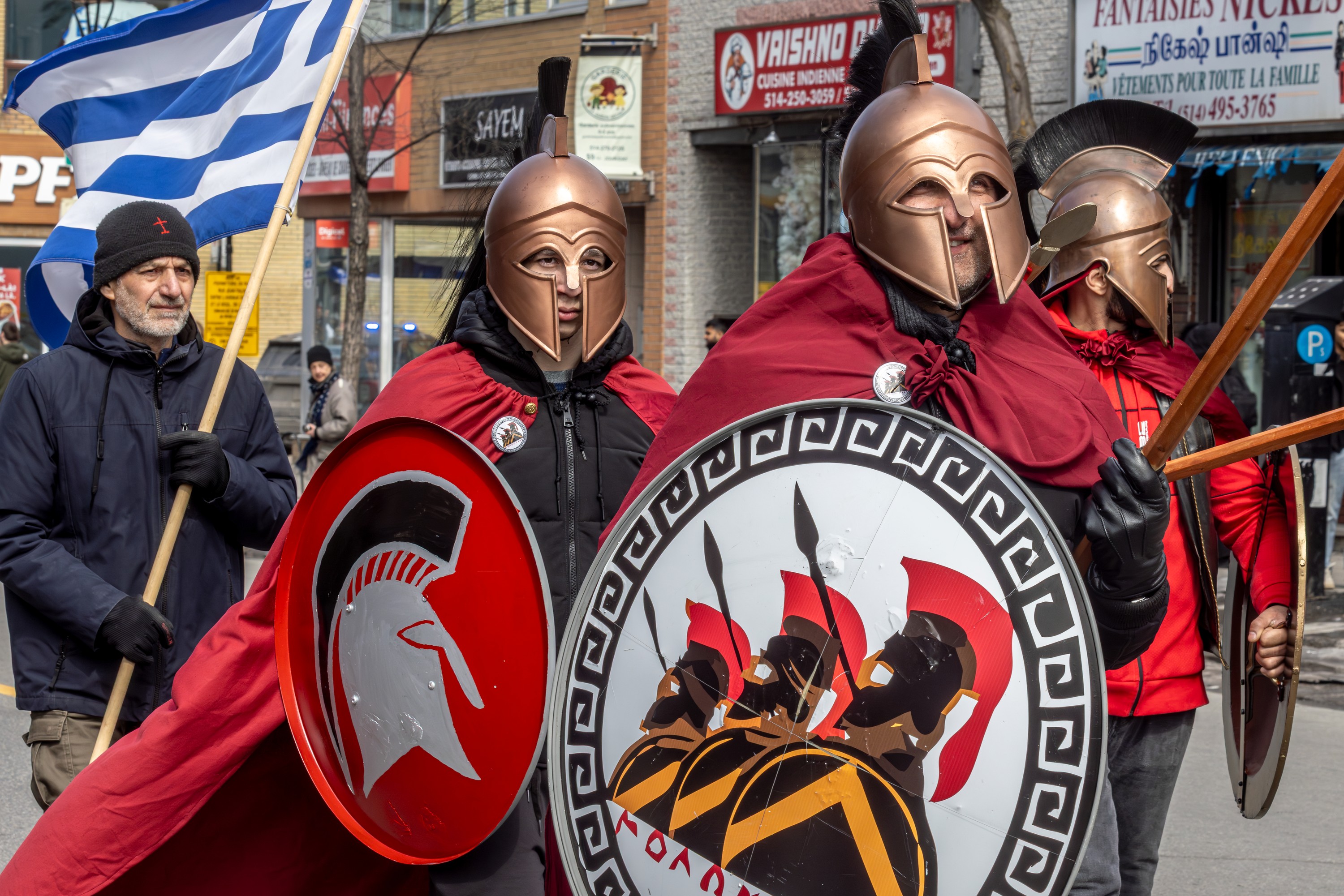 Three Greek Independence Day parade participants in armour.