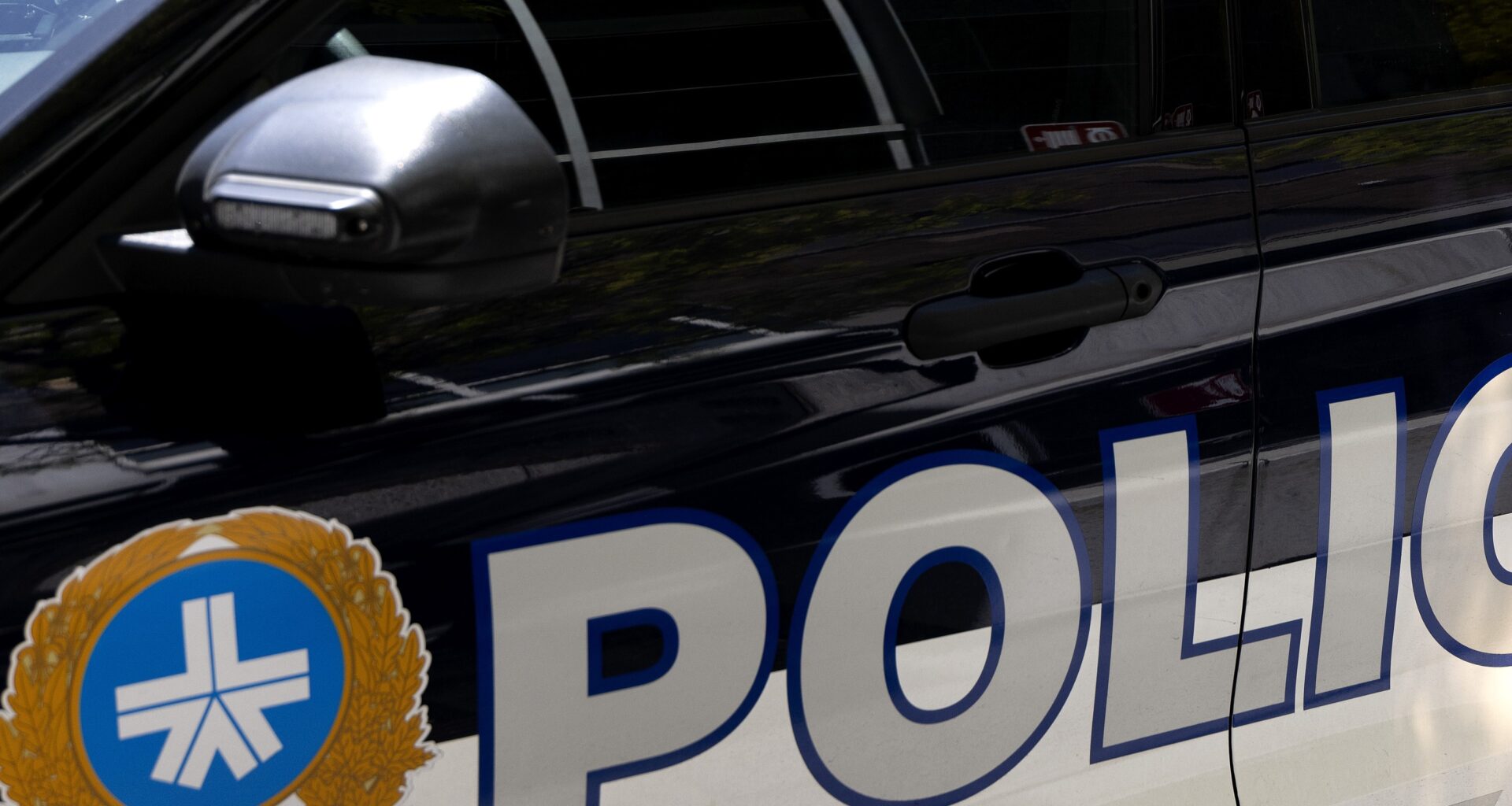 The side of a Montreal police car.