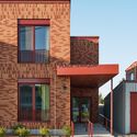 © Ulysse Lemerise Place Tenaquip - Affordable Housing Units / L. McComber - Exterior Photography, Facade, Brick, Door, Concrete
