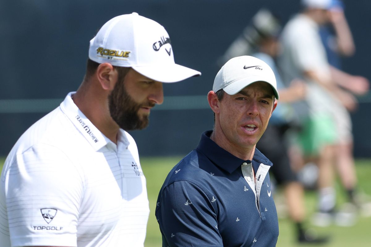 Rory McIlroy talks to Jon Rahm