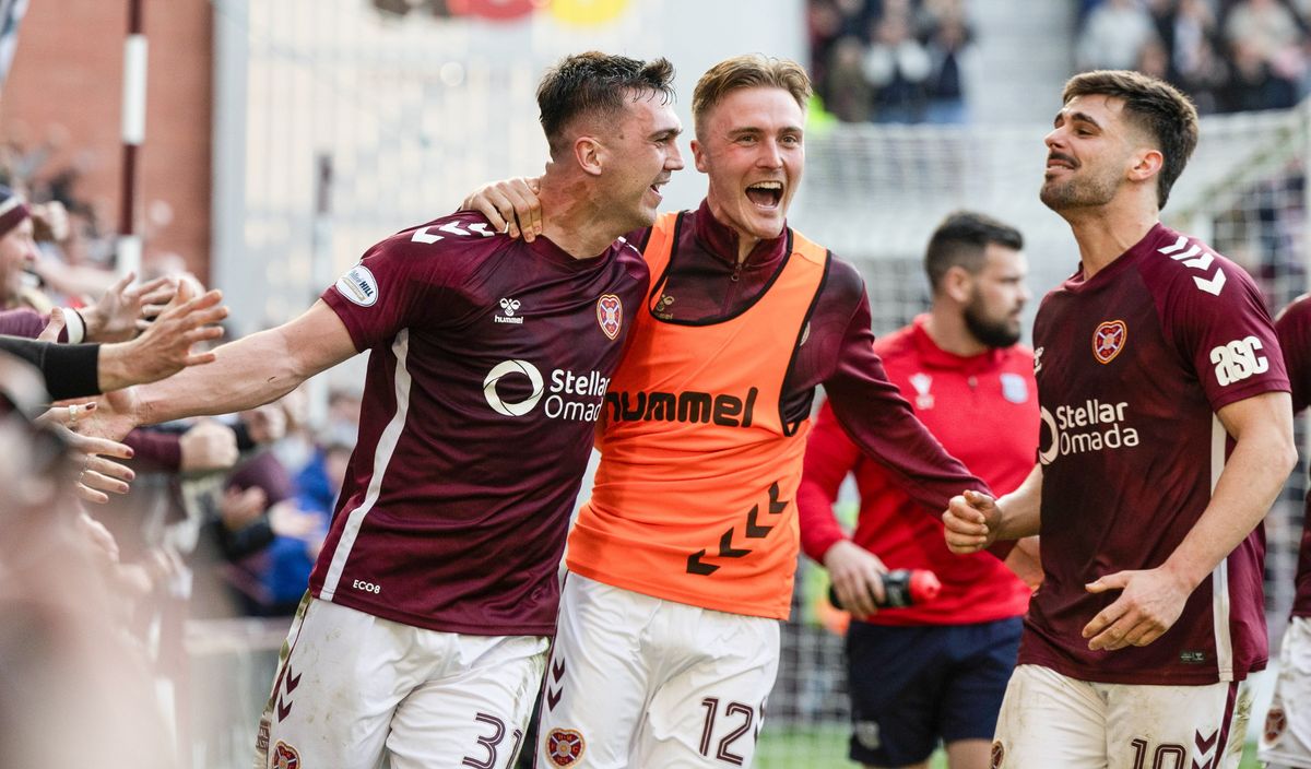 Hearts' Oisin McEntee (L) celebrates scoring to make it 1-0 with Christian Borchgrevink and Claudio Braga vs Dundee