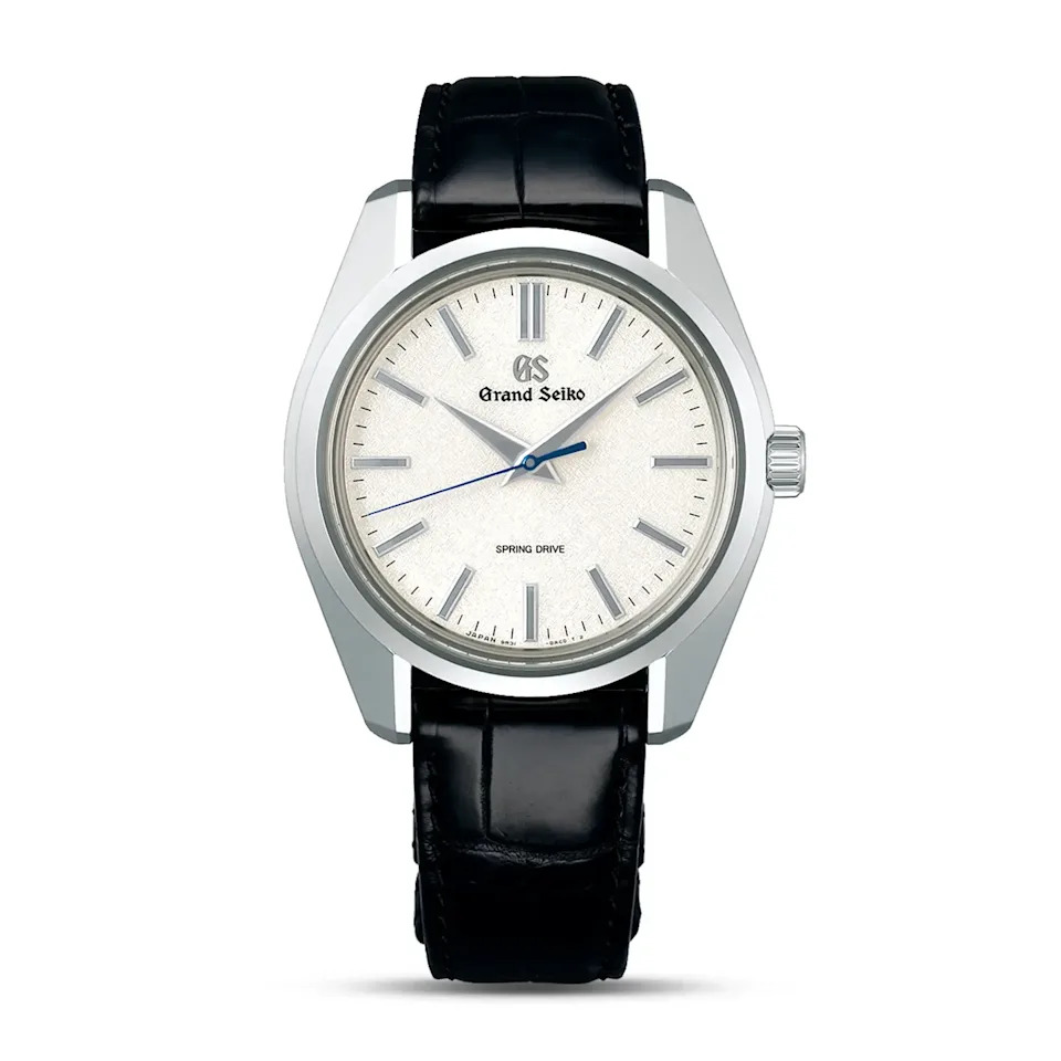 luxury grand seiko watch featuring a silver dial and black leather strap
