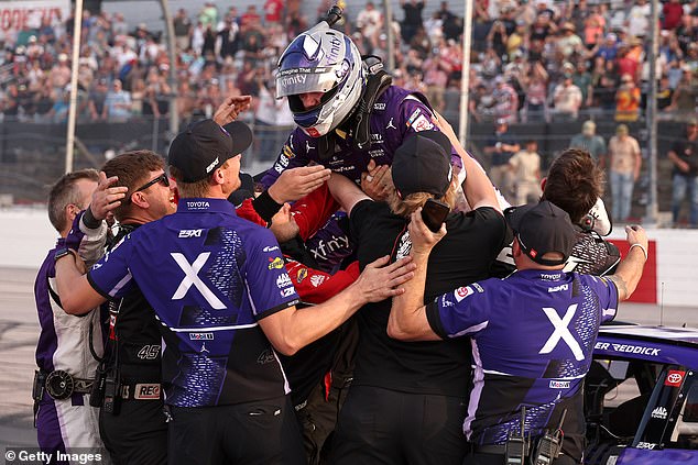 Tyler Reddick, driver of the #45 Xfinity Toyota, celebrates with his crew after winning the NASCAR Cup Series Goodyear 400 at Darlington Raceway on Sunday in South Carolina