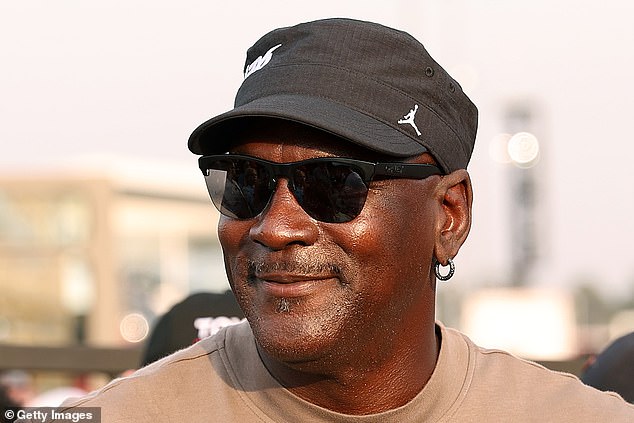 Michael Jordan smiles after his team's fourth victory of the young NASCAR season