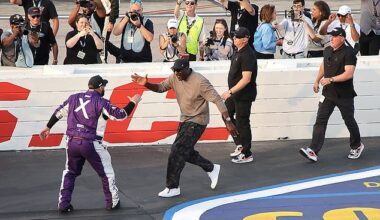 Michael Jordan slaps five with driver Tyler Reddick after their fourth win of the year