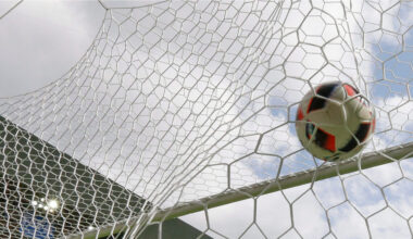 A soccer ball hits a net. (AP/Thanassis Stavrakis)