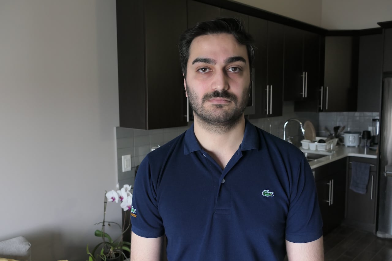 A man standing in a kitchen