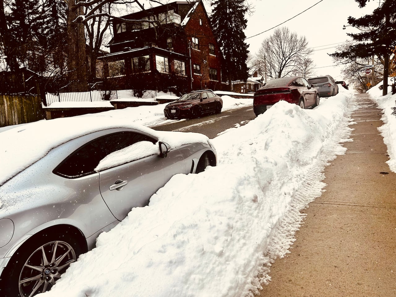 On Glen Stewart Avenue, waist-high snowbanks remain down one side of the street, covering former parking spots.