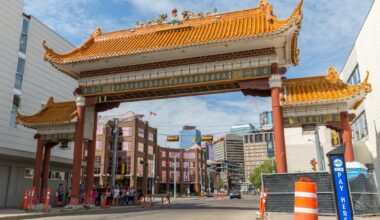 A large arch structure spans a street in Edmonton's Chinatown.
