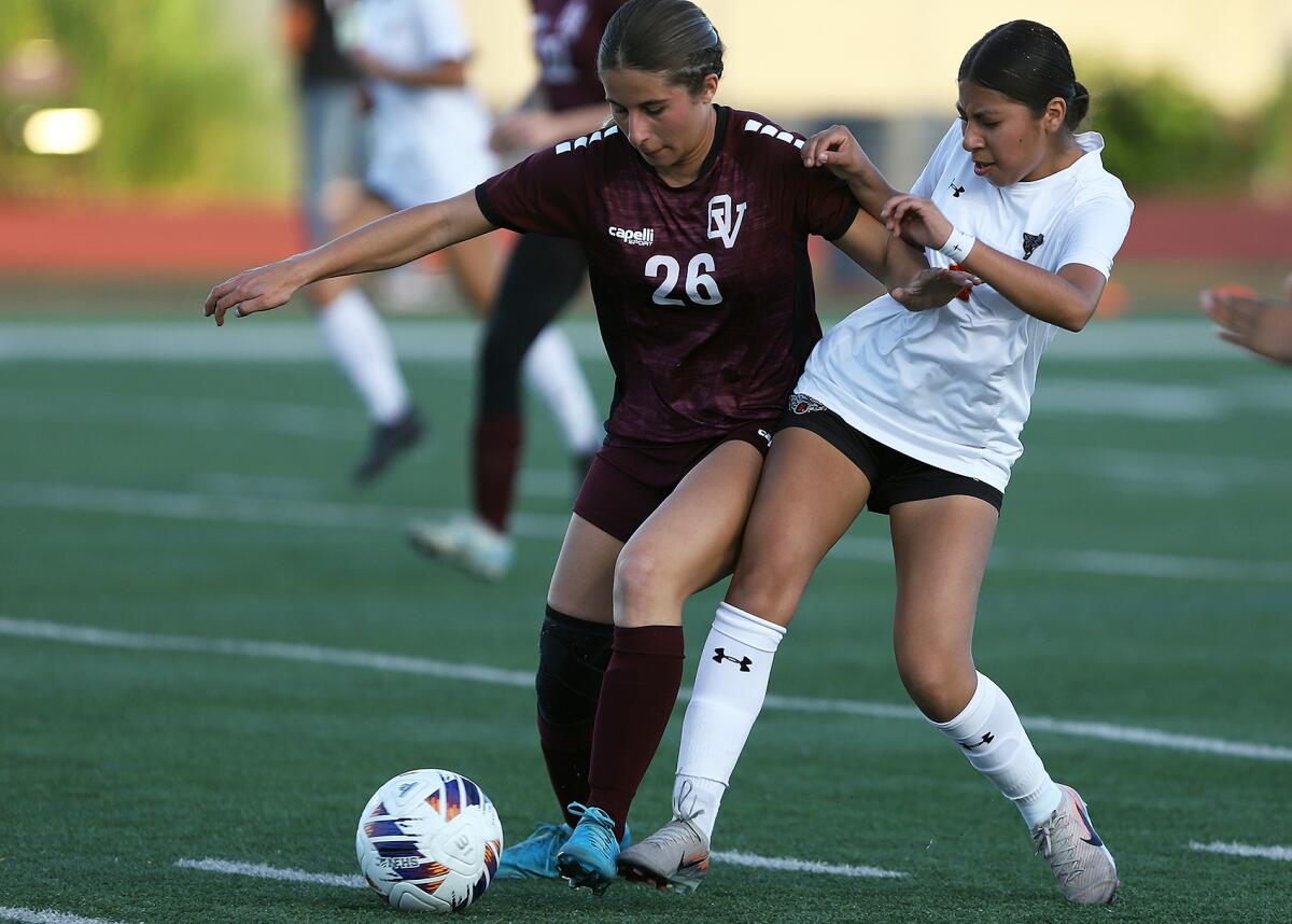 Ocean View's Sofia Matos (26) battles for the ball against Segerstrom's Johanna Cruz (8) during Friday night's match.