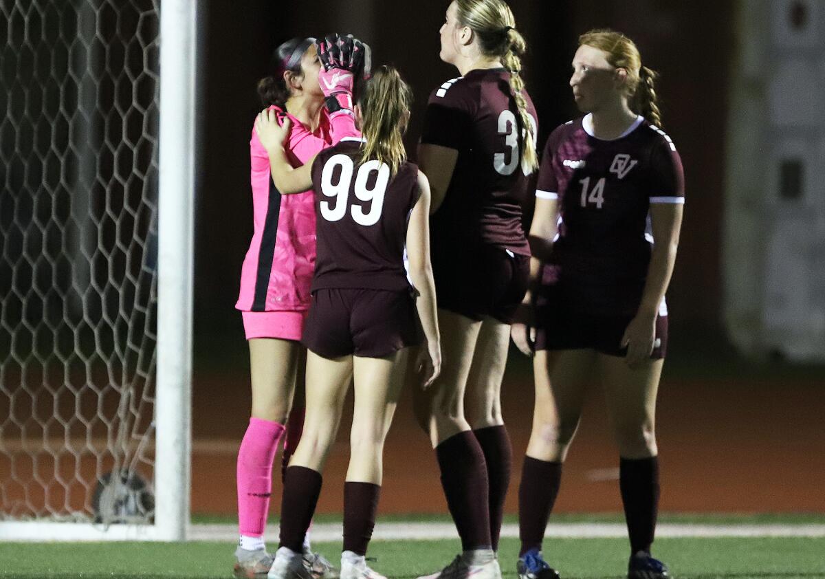 Ocean View goalkeeper Sydnie Enriquez (9) is consoled by teammates following a Segerstrom goal Friday night.