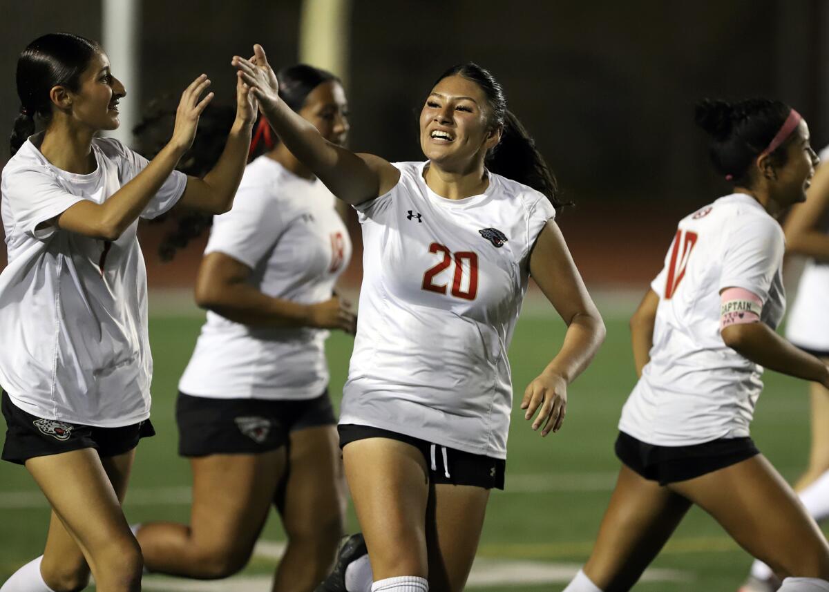 Segerstrom's Aymar Salgado (20) celebrates after scoring a goal against Ocean View on Friday night.