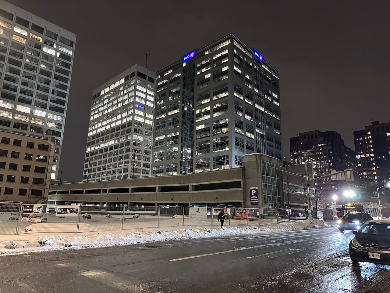 There used to be a highrise to the left of the parking garage, whose full size can now be more clearly seen. 