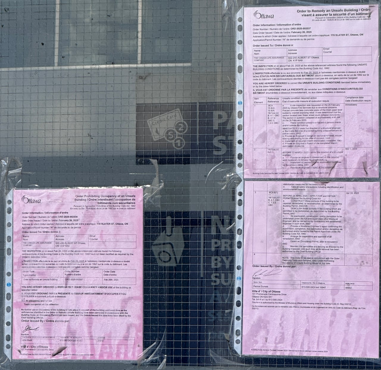 An order from the City of Ottawa prohibiting the building from being occupied is still posted on the fence guarding the garage's south side. 