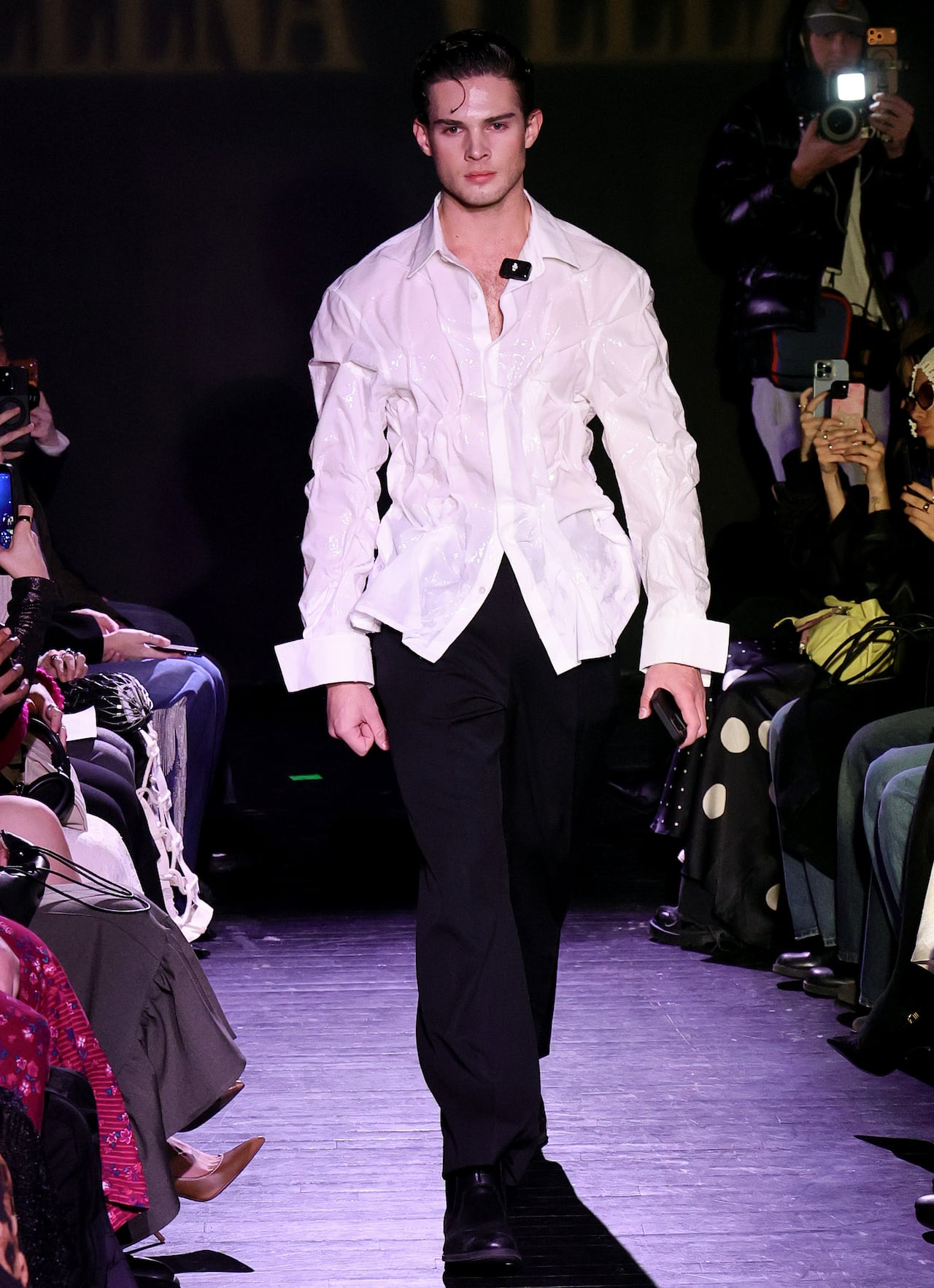 A male model walks a runway
