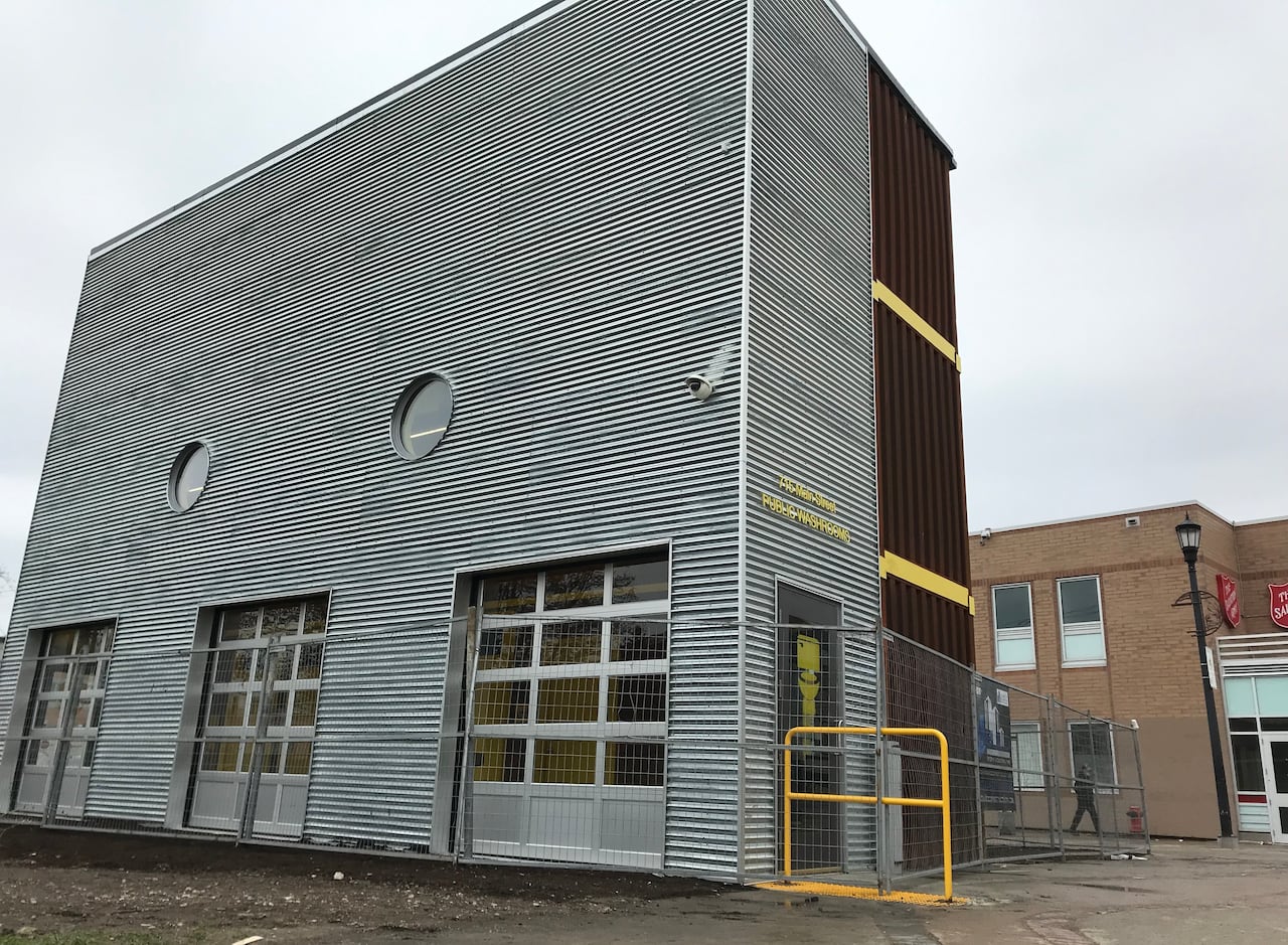 A structure made of shipping containers is shown in this photo.