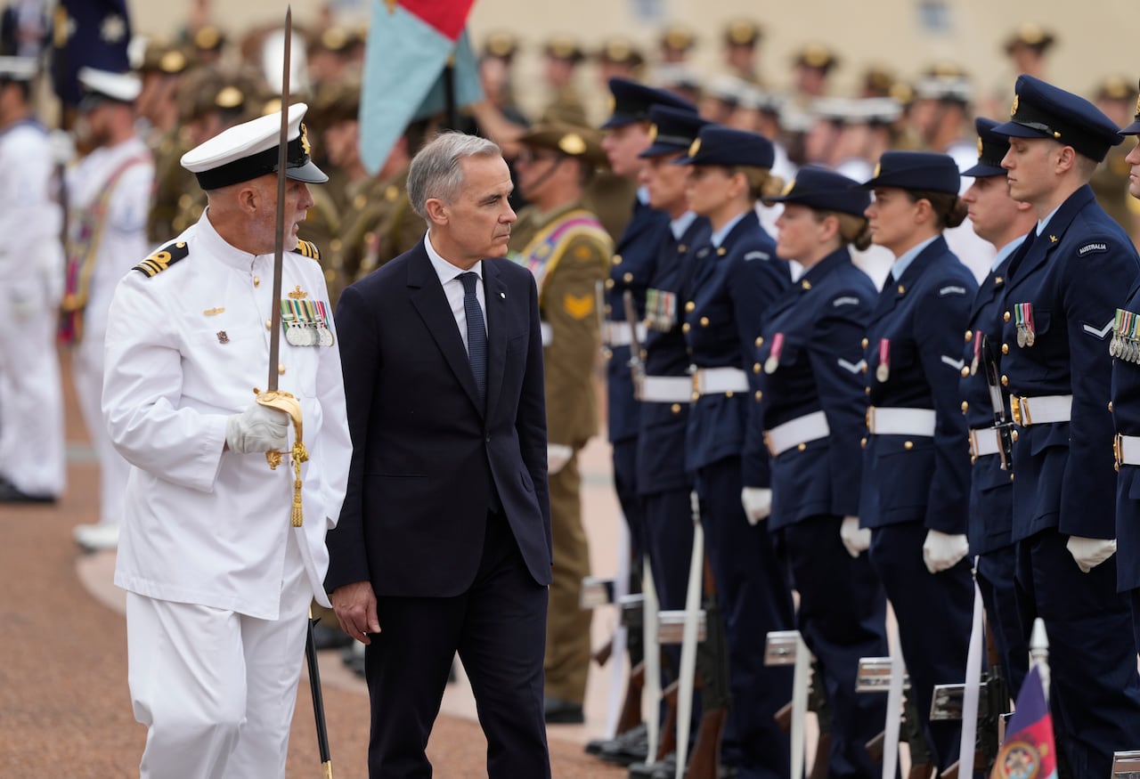 Prime Minister Mark Carney participates in an official welcome at Parliament in Canberra, Australia, Thursday, March 5, 2026.