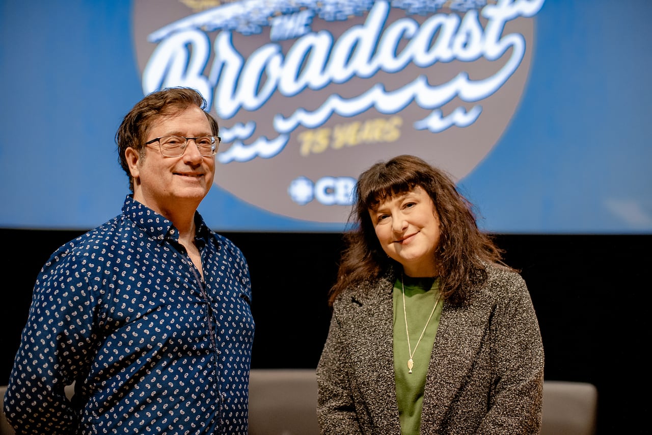 Two people standing side by side