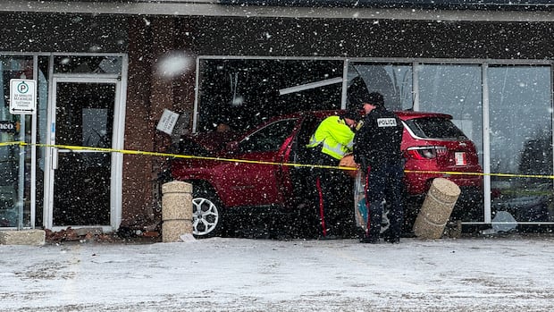 SUV crashes into front of Winnipeg strip mall