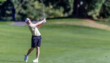 Finn Koelle hits a shot to a par 3 over water