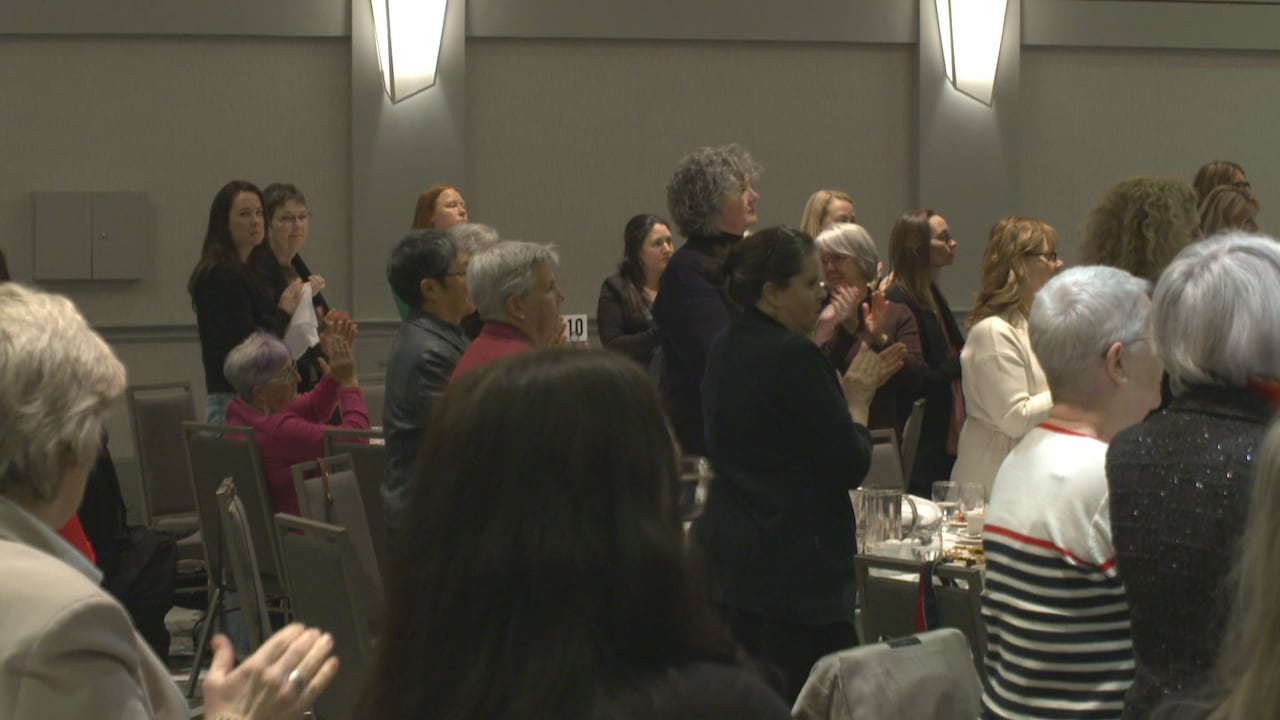 People standing up and clapping