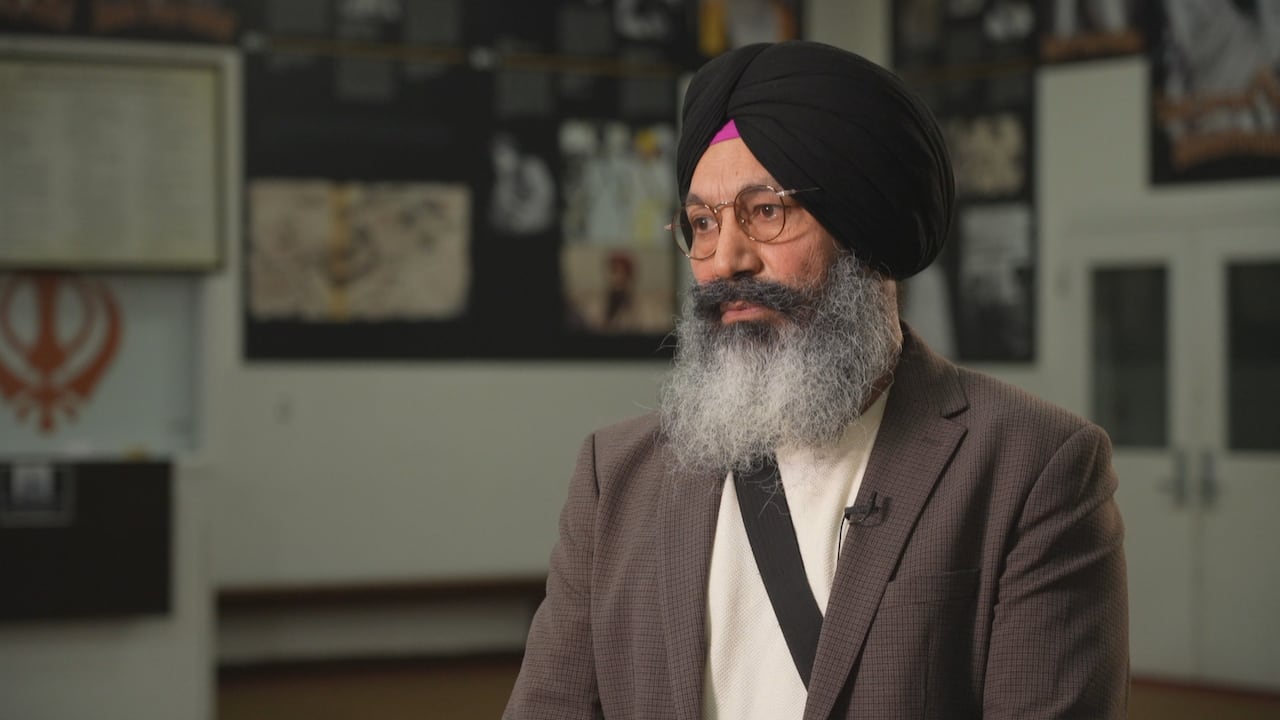 A man speaks to a reporter off screen