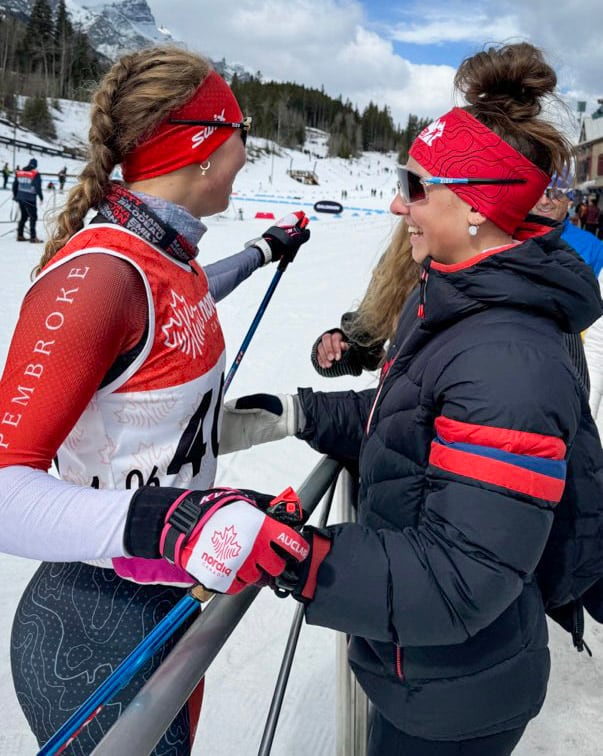 sisters smiling at each other 