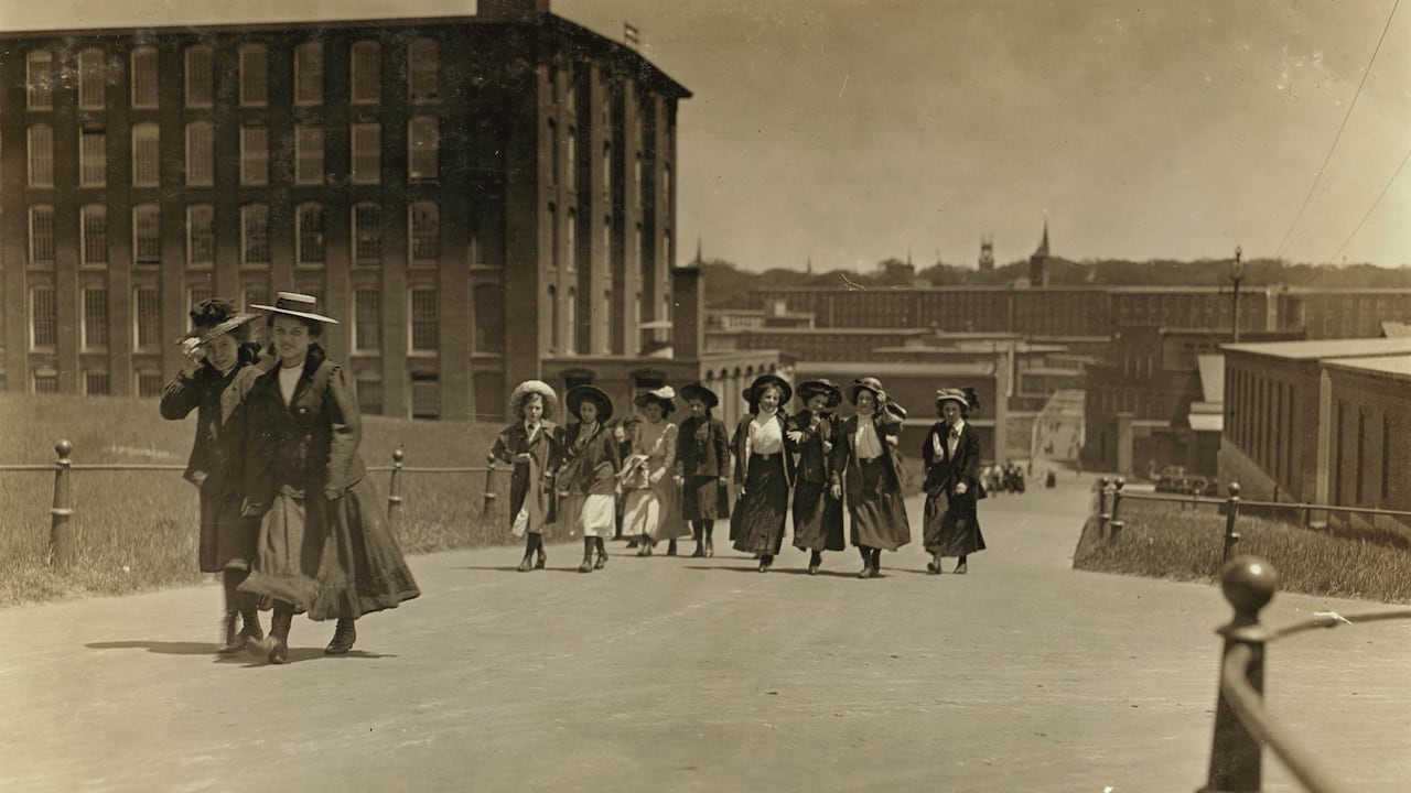 A black and white photo from 1909 shows young women and girls who worked in the surrounding brick buildings.