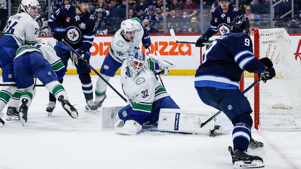 Morrissey's OT goal lifts Jets to 3-2 victory over Canucks