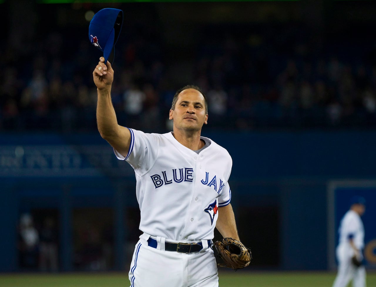 A baseball player waves to the crowd