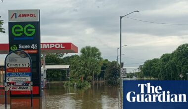 ‘A saltwater crocodile on the AFL oval’: worst flooding in decades inundates NT as residents urged to avoid water | Flooding