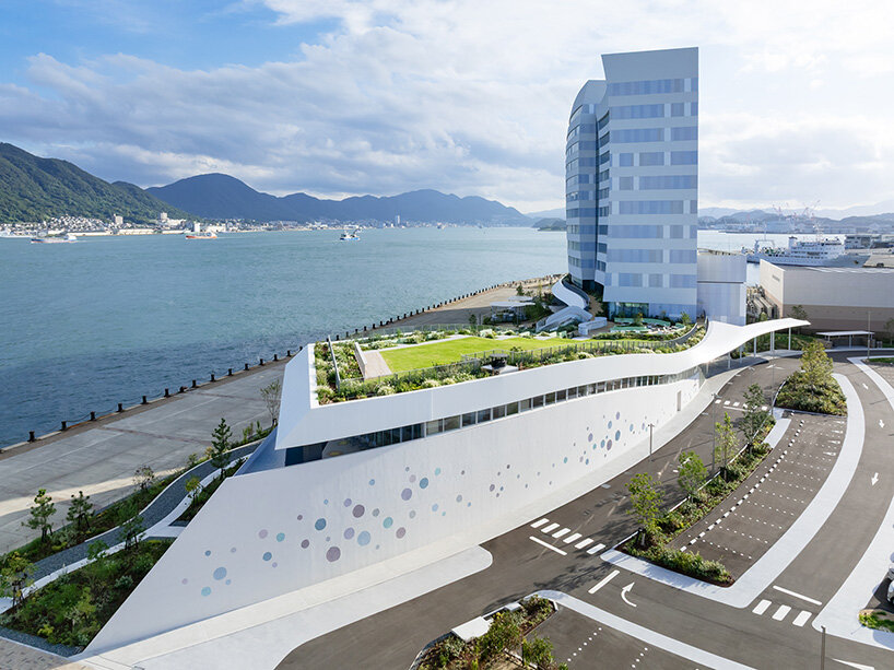 curved twin volumes shape the risonare shimonoseki hotel along japan's kanmon strait - 2