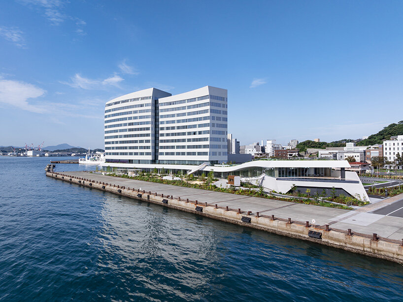 curved twin volumes shape the risonare shimonoseki hotel along japan's kanmon strait - 3