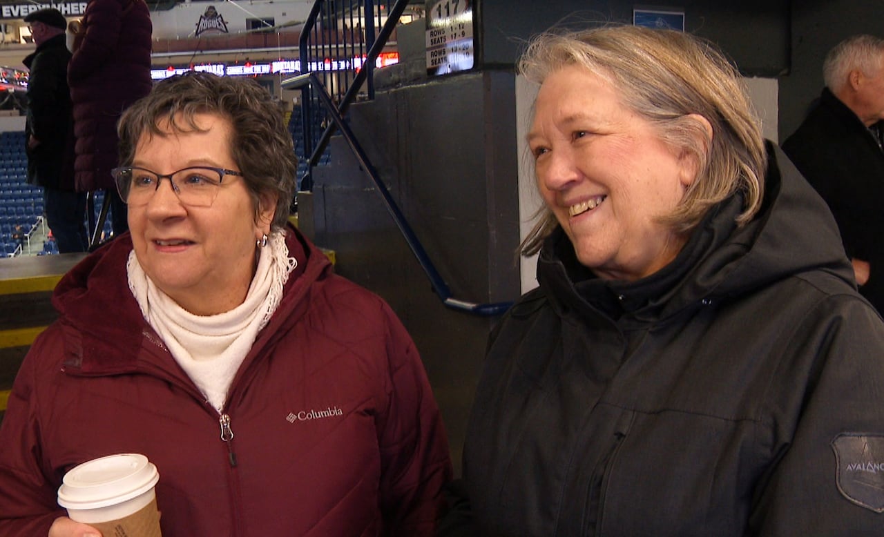 Two women wearing winter coats
