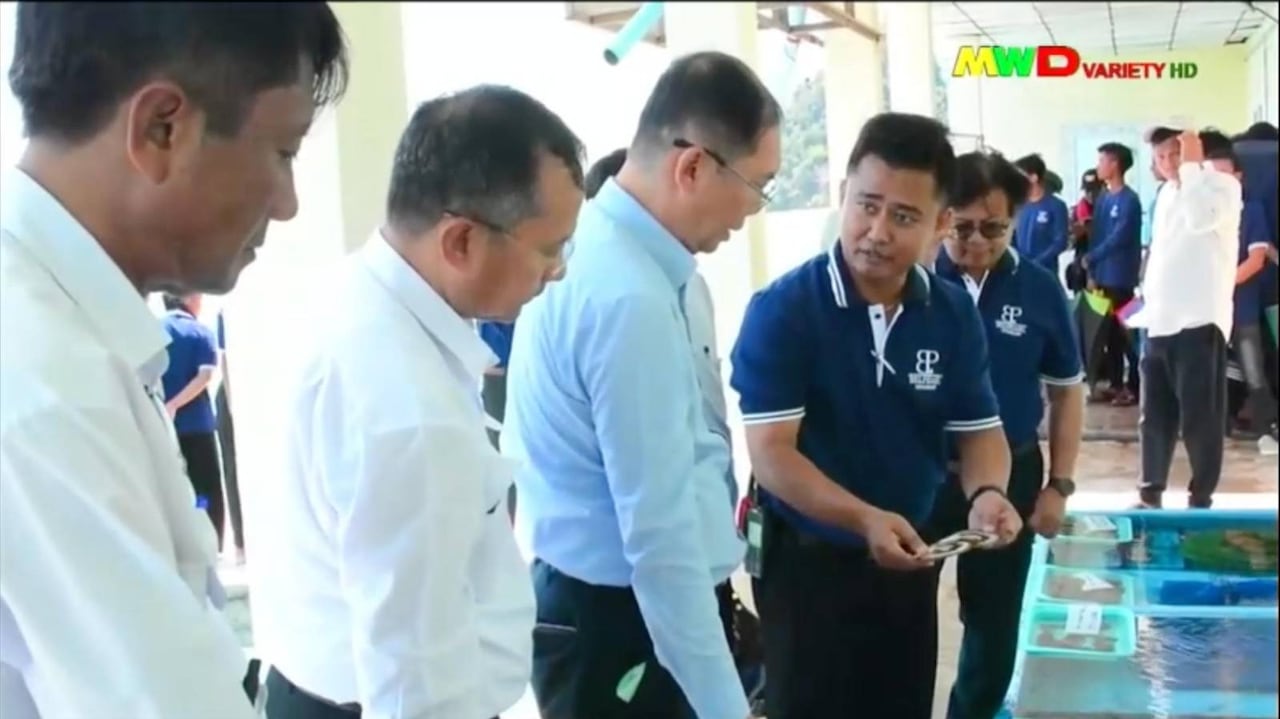 Several men at a pearl farm.