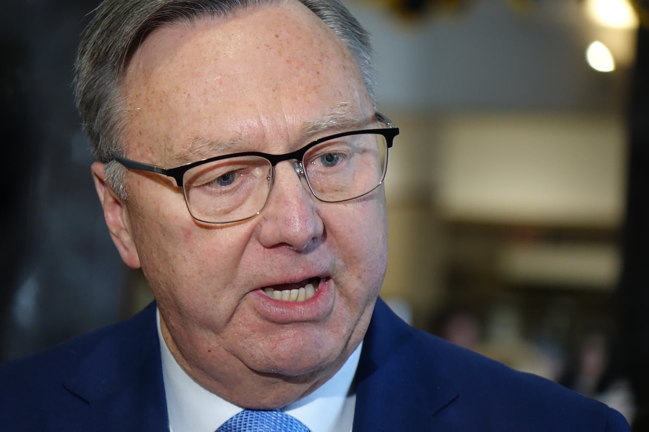 Man with glasses, mouth open