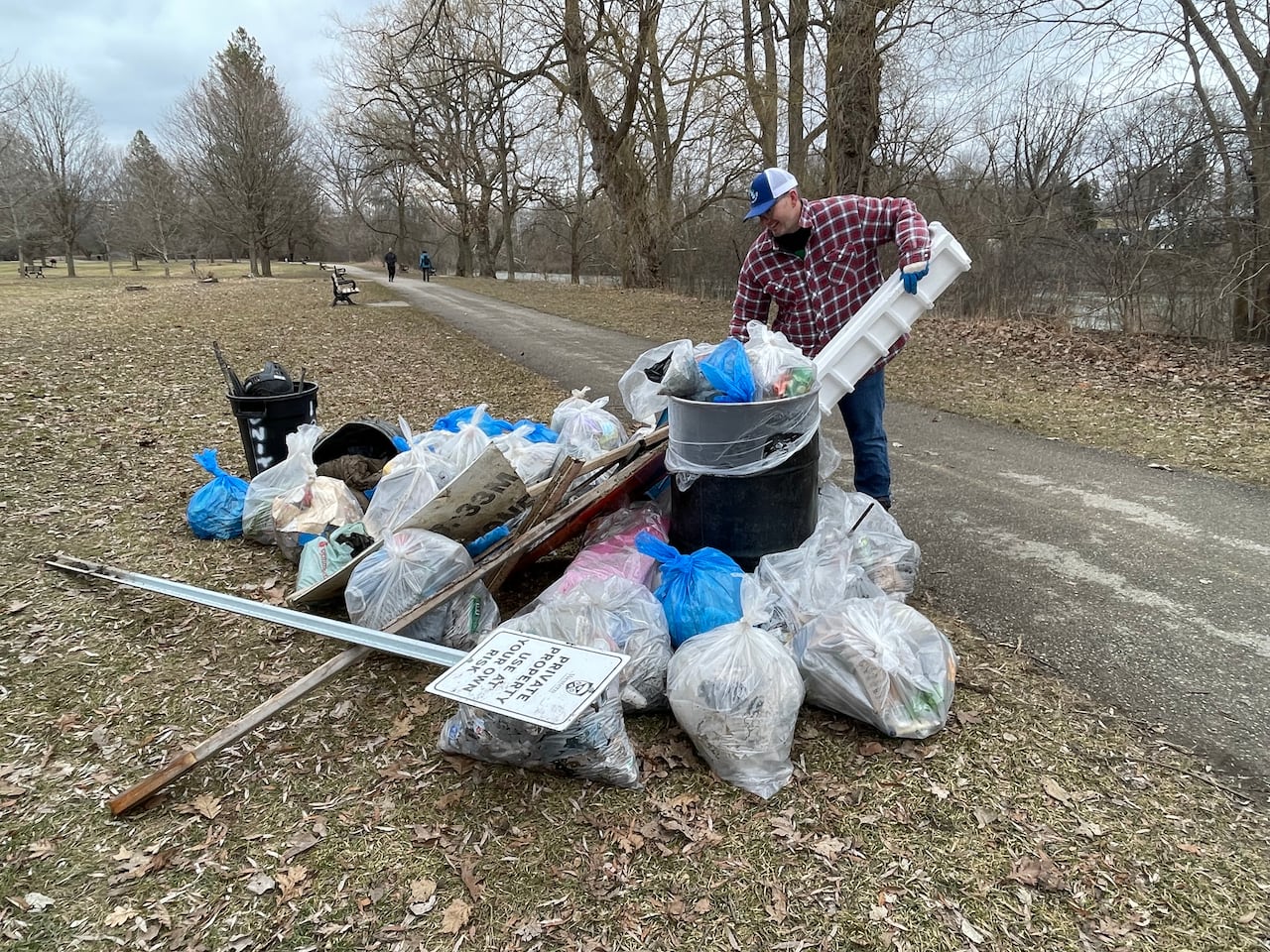 Tom Cull adds a piece of Styrofoam he found in a stream. 