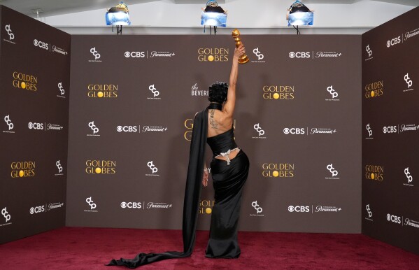 Teyana Taylor poses in the press room with the award for best performance by a female actor in a supporting role in any motion picture for "One Battle After Another" during the 83rd Golden Globes in Beverly Hills, Calif., on Jan. 11, 2026. (AP Photo/Chris Pizzello, File)