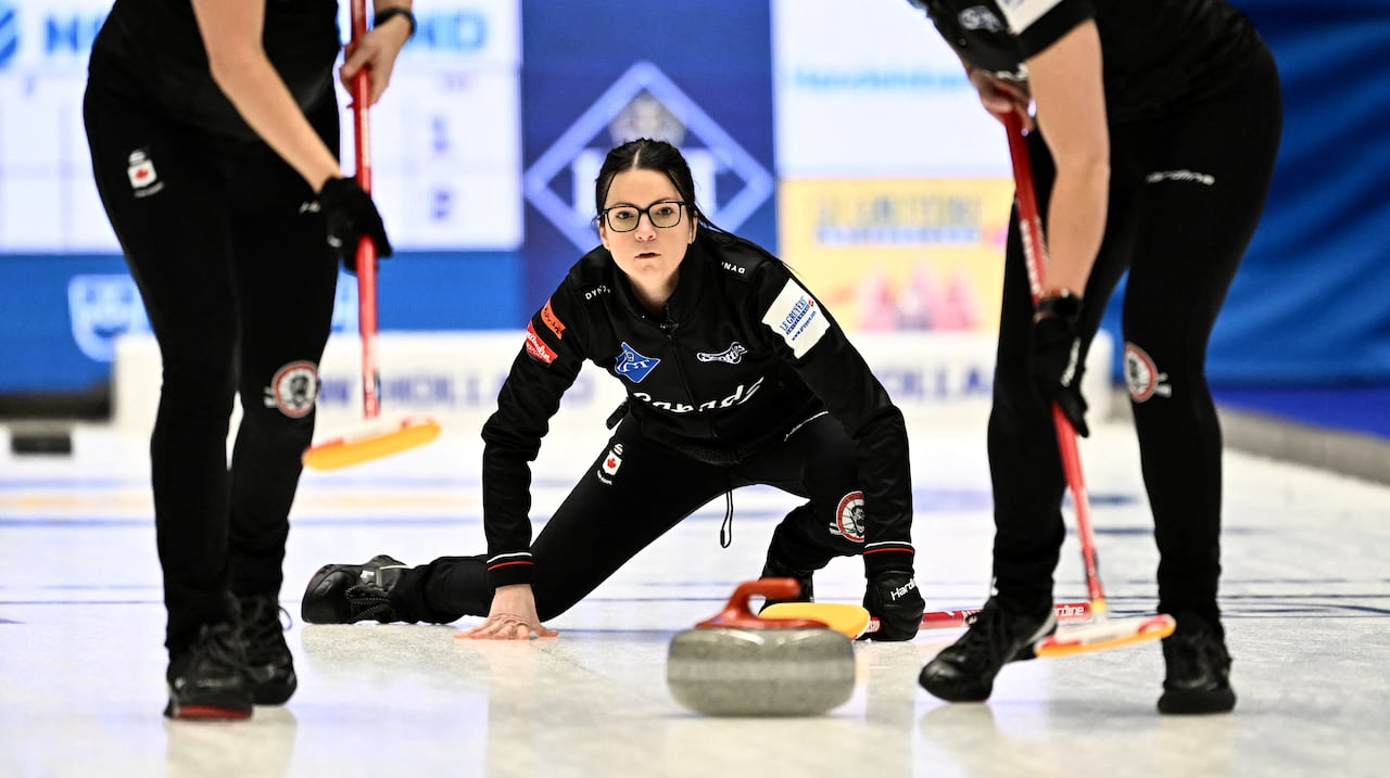 A Canadian curling team in action.