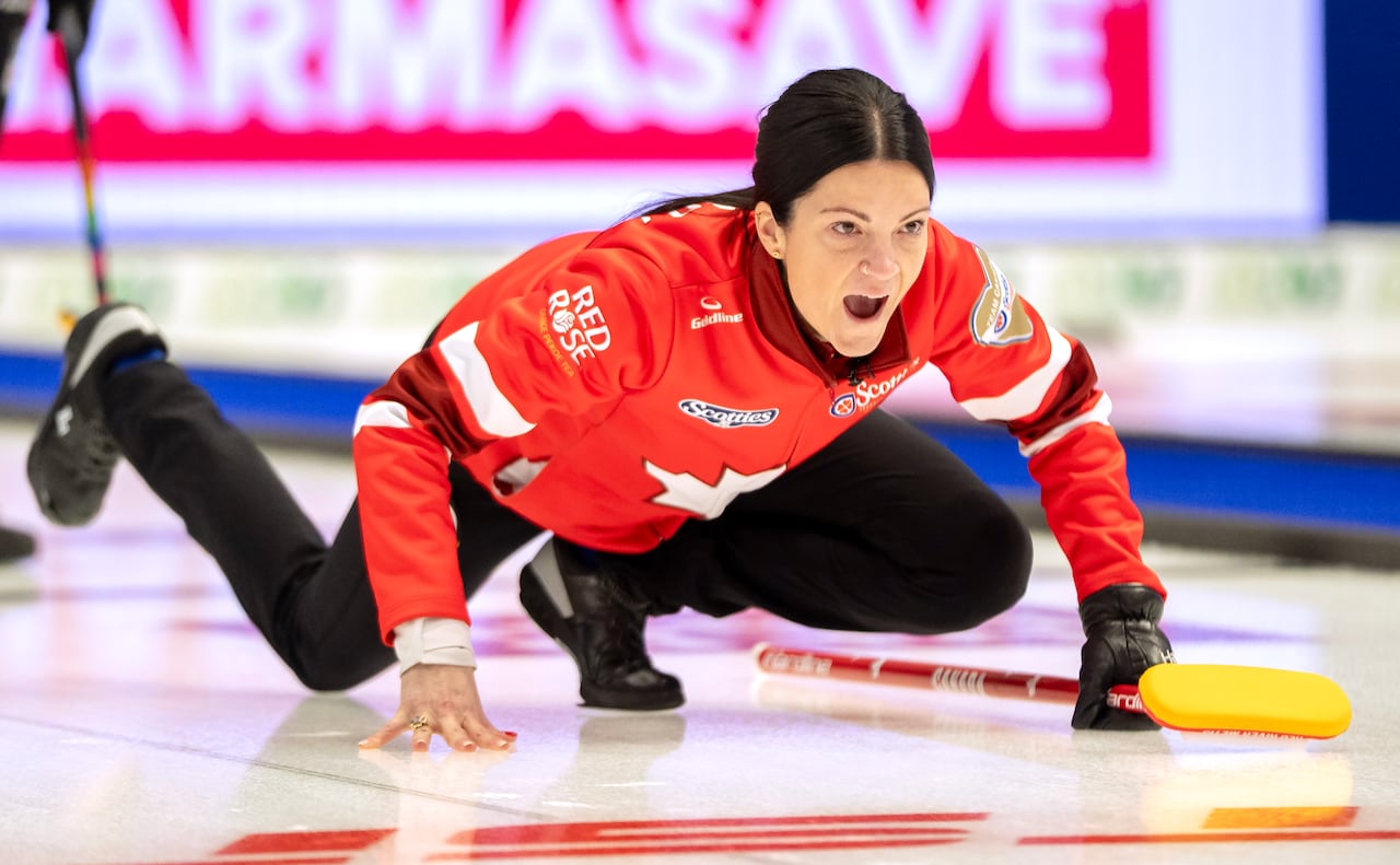 A Canadian curling skip calls a sweep during a game.