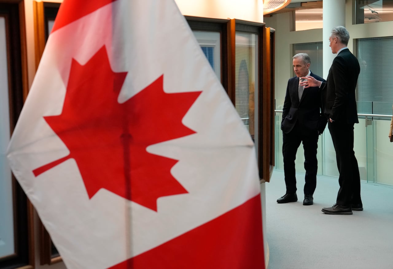 A Canadian flag and two men