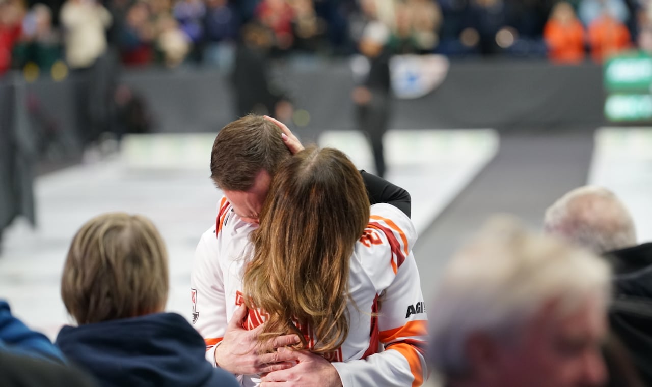 A man and a woman hugging.