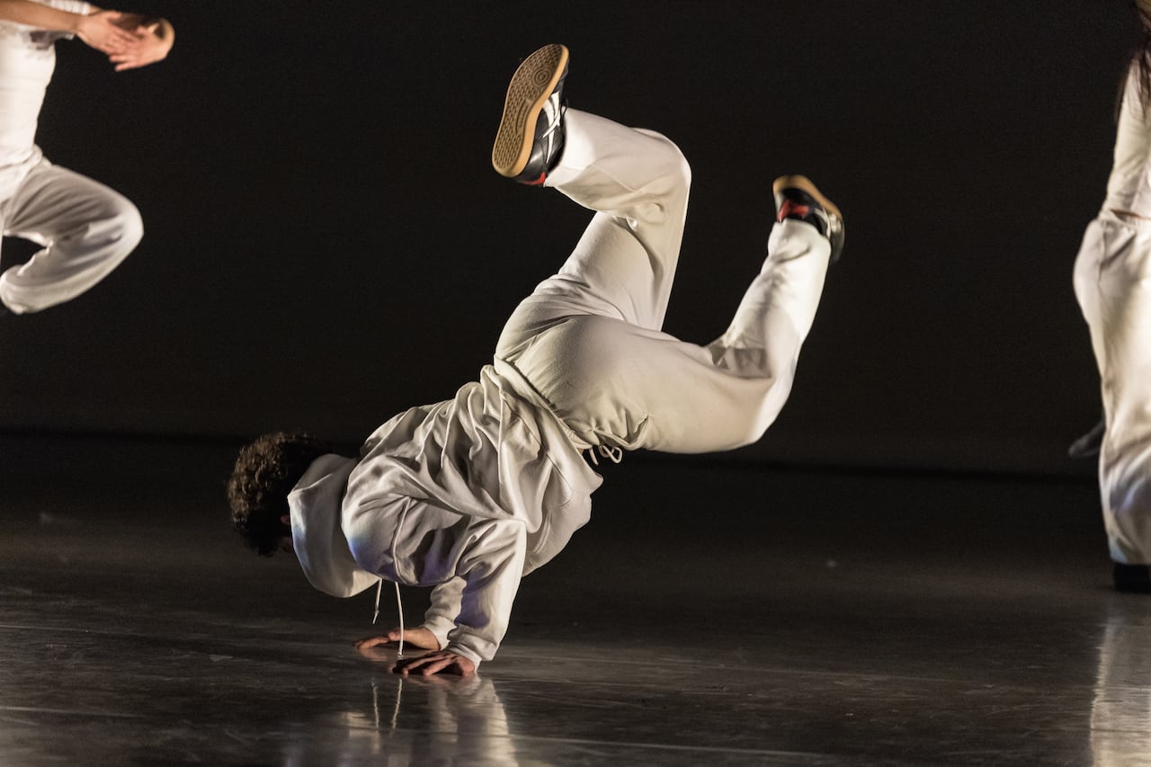People dancing, dressed in white