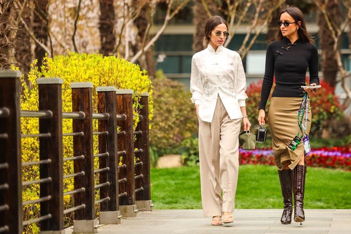 Alexandra Leclerc and Carmen Montero Mundt walk in the paddock.