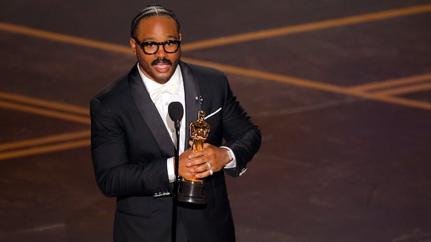 Ryan Coogler holds an oscar