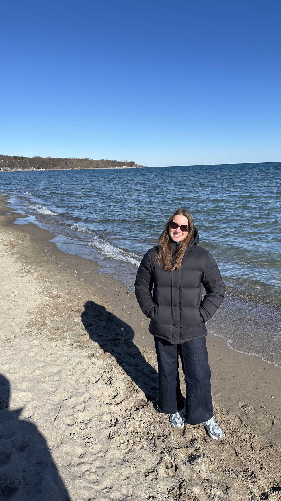 A person stood on a beach.
