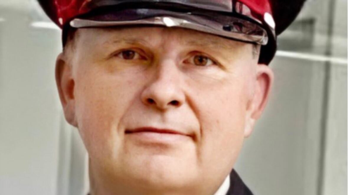 A man looks to the camera.