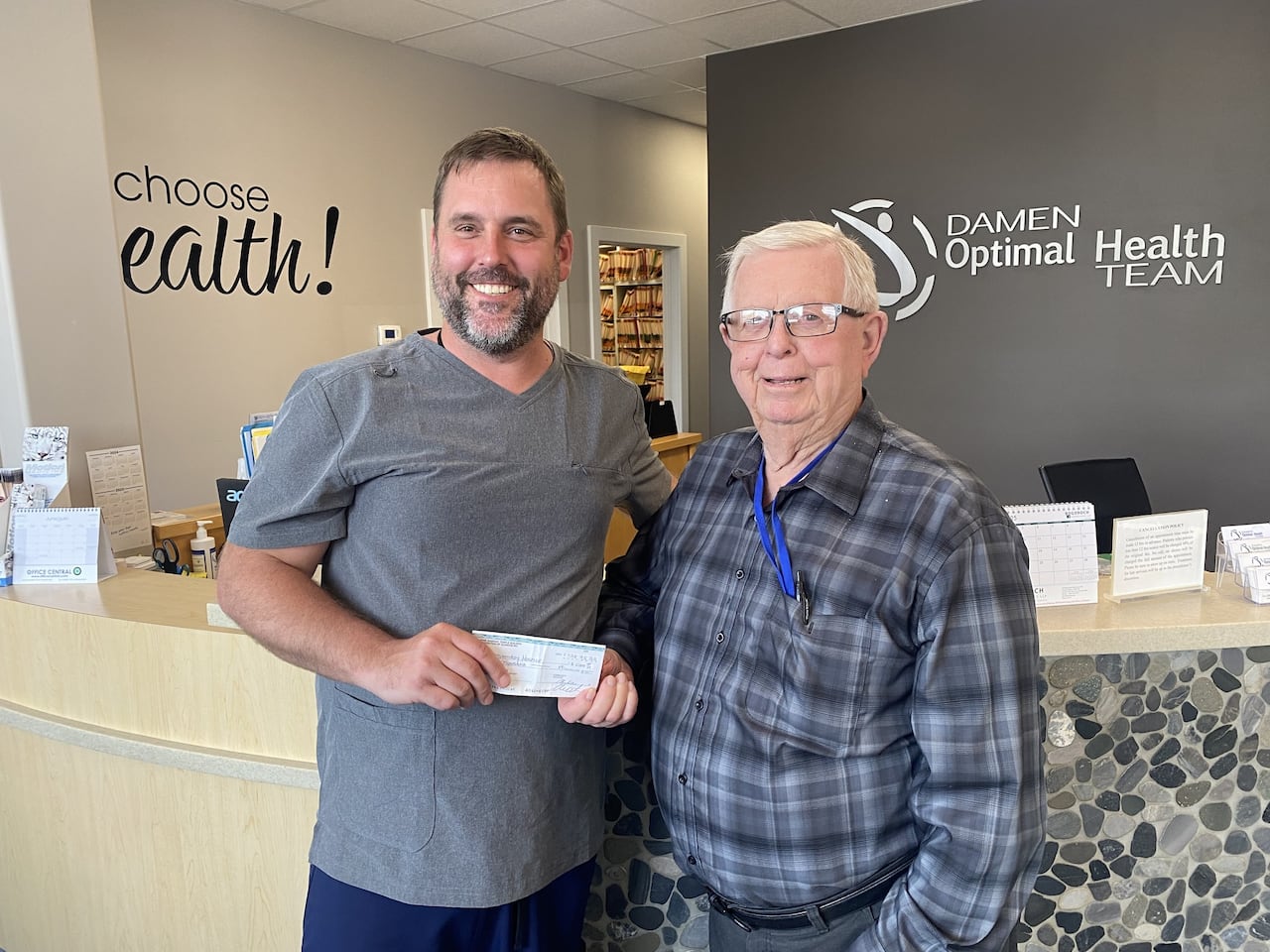 cheque presentation between two men